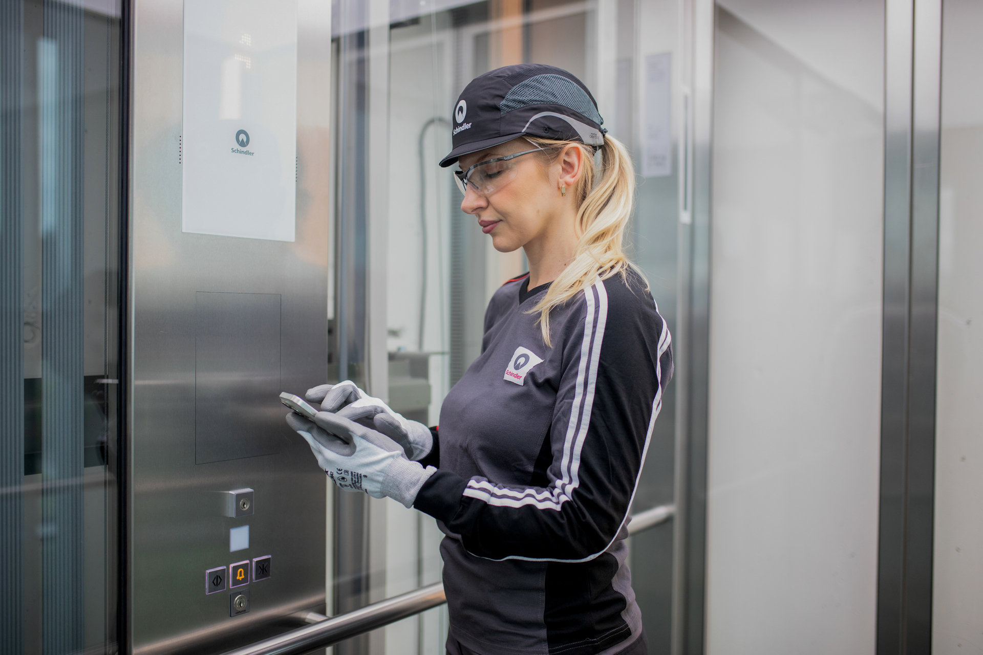 Schindler technician checks elevator data